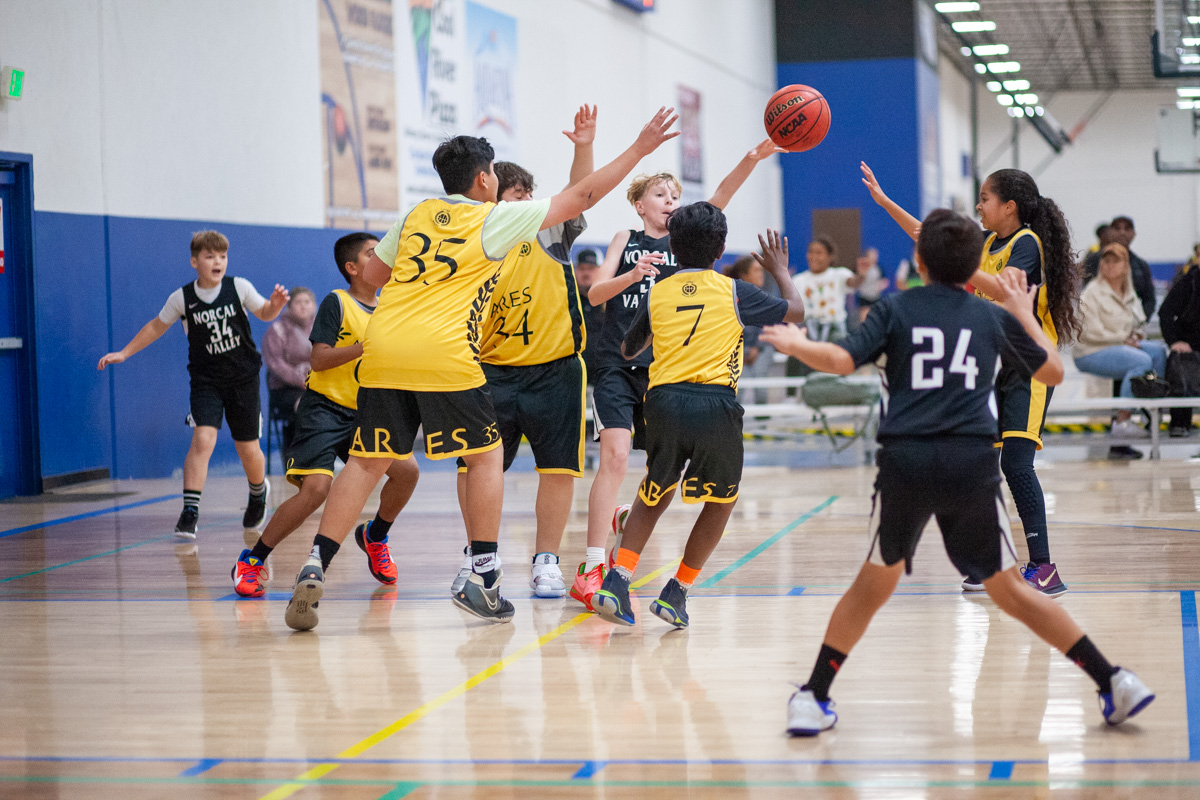 Ares basketball players playing basketball